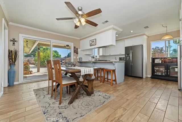 a view of a dining room with furniture window and outside view
