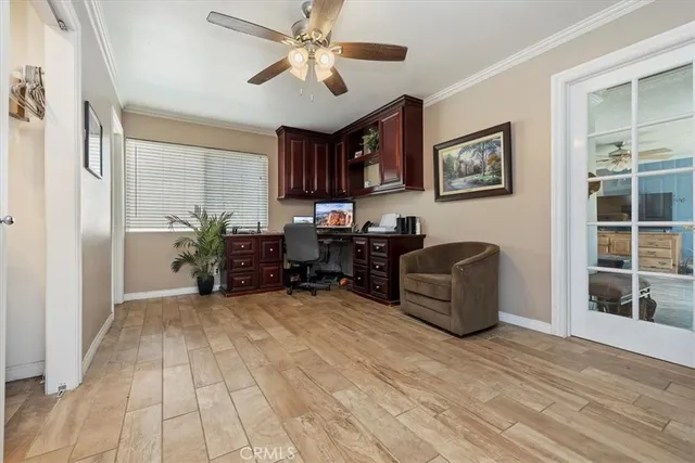 a view of a livingroom with furniture and a workspace