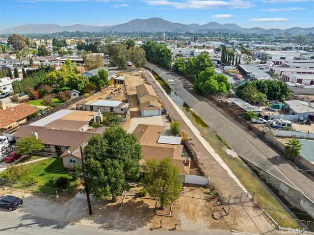 an aerial view of residential houses with outdoor space