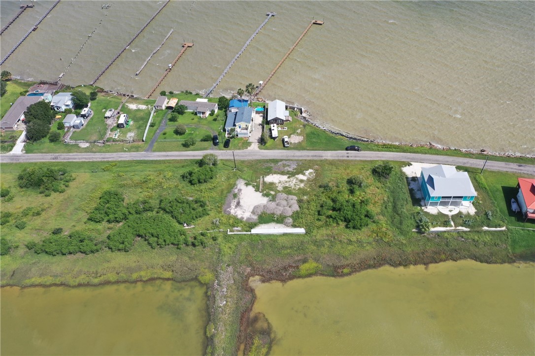 455 Egery Island Road Taft, TX 78390 - Photo 4 of 12 a view of a lake from a yard