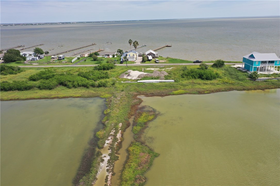 455 Egery Island Road Taft, TX 78390 - Photo 6 of 12 a view of a lake from a yard