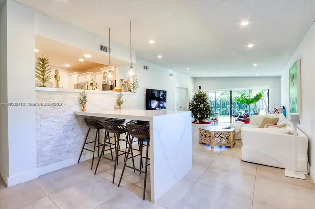 a living room with fireplace furniture and a flat screen tv