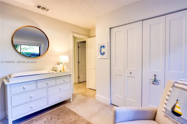 a spacious bathroom with a double vanity sink and a mirror