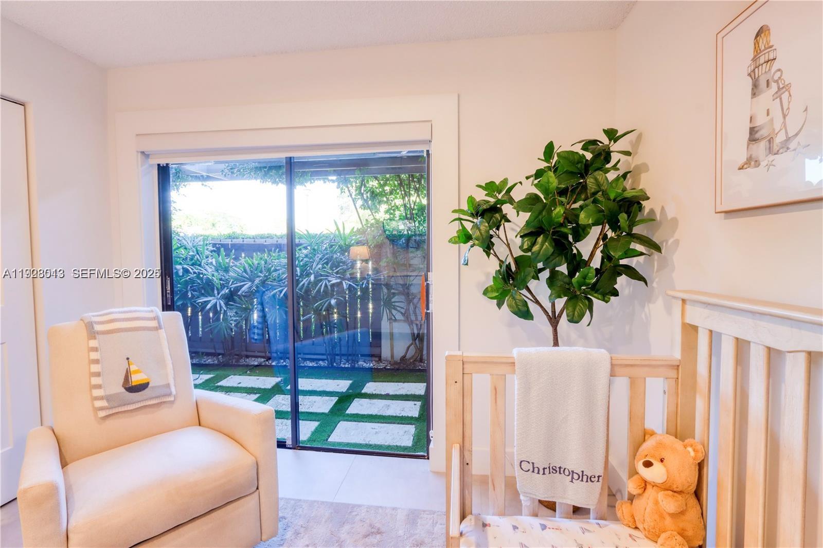 10478 Southwest 75th Lane, Unit 10478 Miami, FL 33173 - Photo 22 of 42 a room with furniture and a potted plant