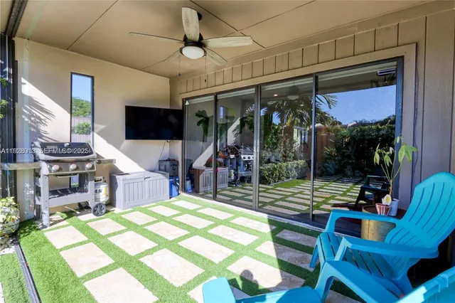 a view of a patio with a dining table and chairs