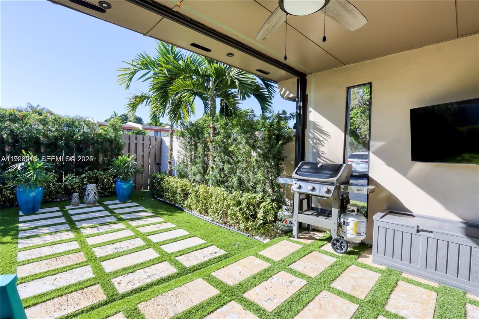 10478 Southwest 75th Lane, Unit 10478 Miami, FL 33173 - Photo 37 of 42 a garden view with a seating space
