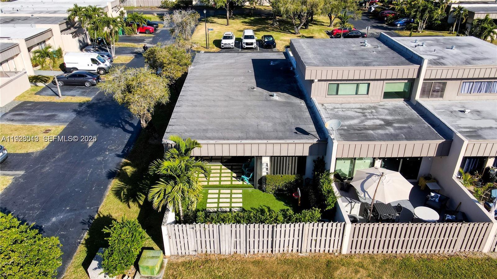 10478 Southwest 75th Lane, Unit 10478 Miami, FL 33173 - Photo 38 of 42 an aerial view of a house with a yard