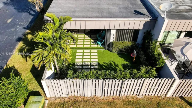 a view of a backyard of the house