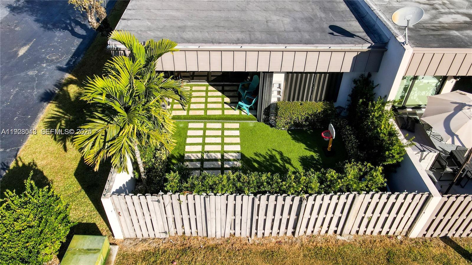 10478 Southwest 75th Lane, Unit 10478 Miami, FL 33173 - Photo 40 of 42 a view of a backyard of the house
