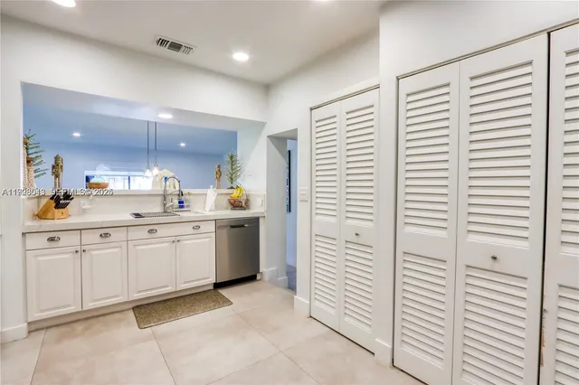 a bathroom with a sink a vanity and a mirror