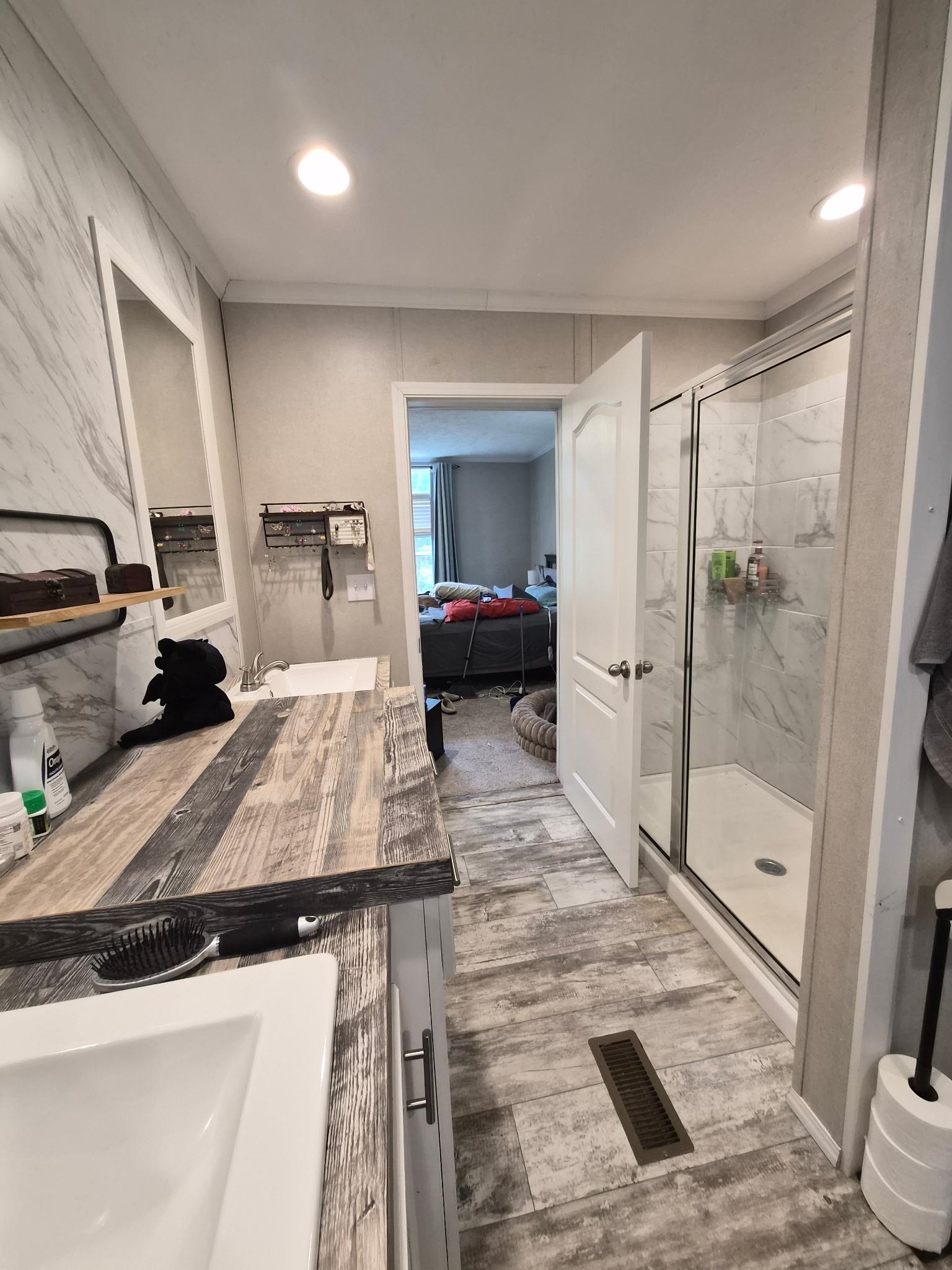 510 Potts Chapel Road Jackson, TN 38305 - Photo 16 of 30 Full bath featuring vanity, connected bathroom, a marble finish shower, light wood-style flooring, and recessed lighting