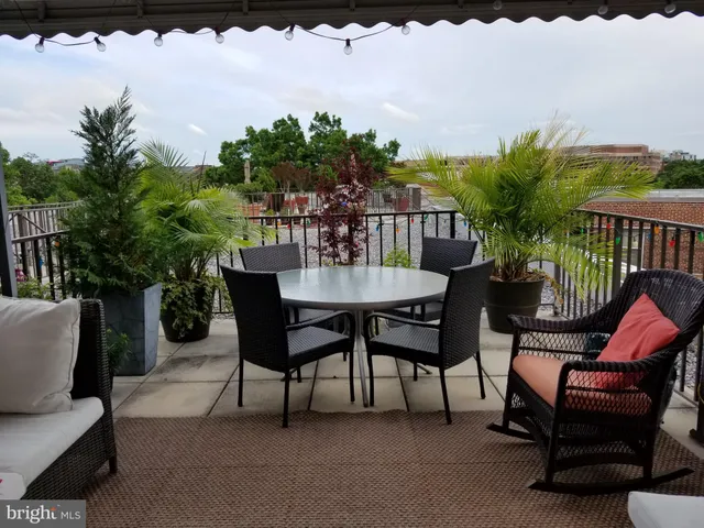 a view of a chairs and table in the patio
