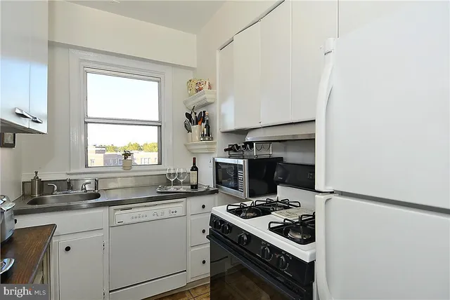 a kitchen with a stove and a refrigerator