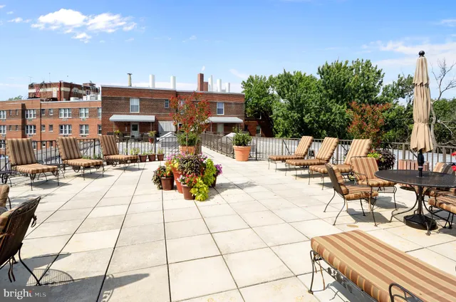 a view of a balcony with chairs