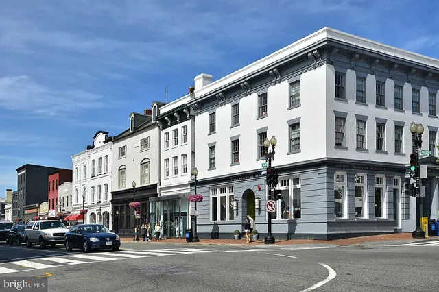 a view of a building and car parked