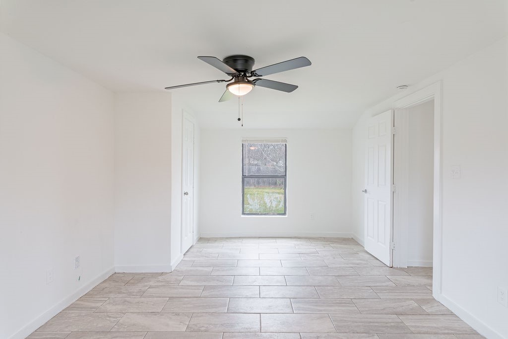 1307 Boulder Street Houston, TX 77012 - Photo 3 of 14 a view of an empty room and window with a fan