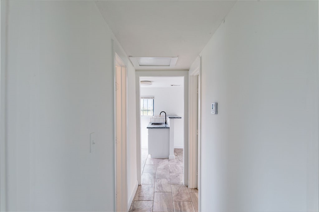 1307 Boulder Street Houston, TX 77012 - Photo 4 of 14 a en suite bathroom with a granite countertop sink and a mirror