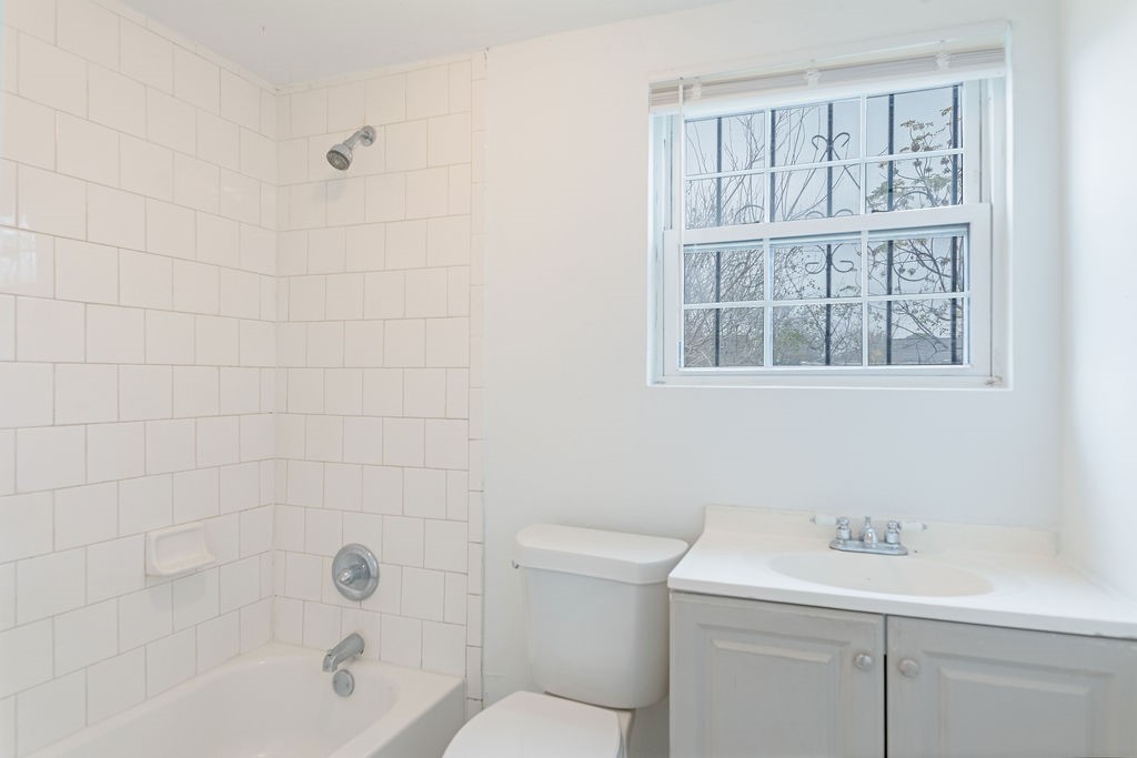 1307 Boulder Street Houston, TX 77012 - Photo 5 of 14 a bathroom with a sink a toilet and shower