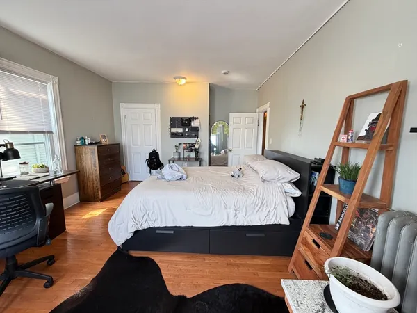 a bed room with a bed and furniture