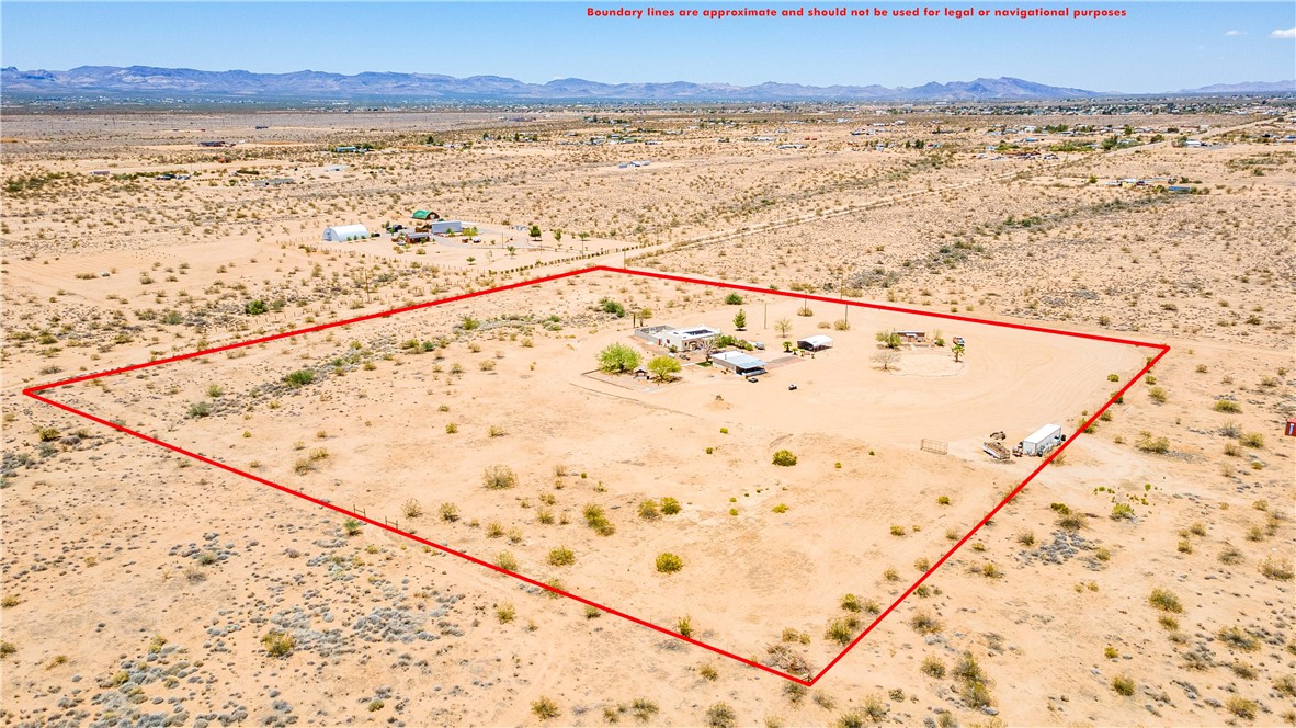 1692 South Verde Road Golden Valley, AZ 86413 - Photo 37 of 39 Aerial view of sparsely populated area with property boundaries highlighted