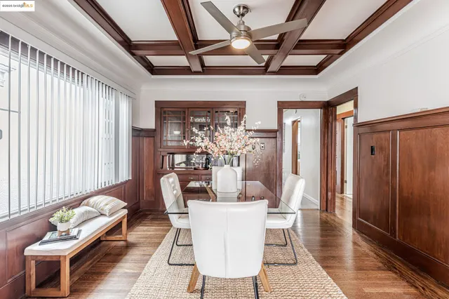 a dining room with furniture and window