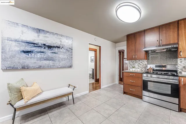 a kitchen with stainless steel appliances granite countertop a stove and a sink