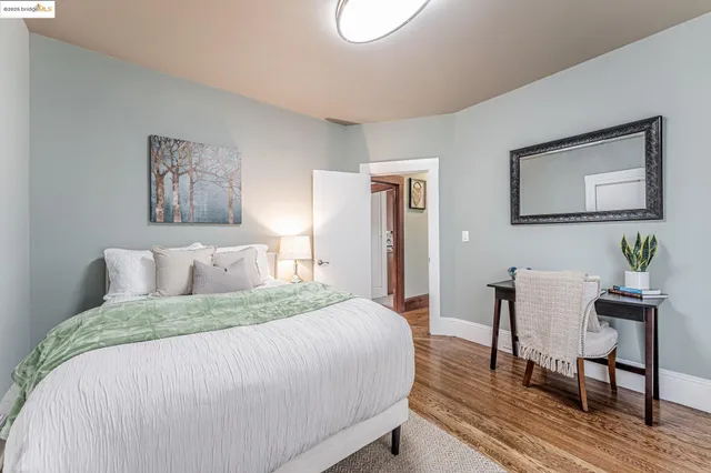 a bedroom with a bed and a table in it