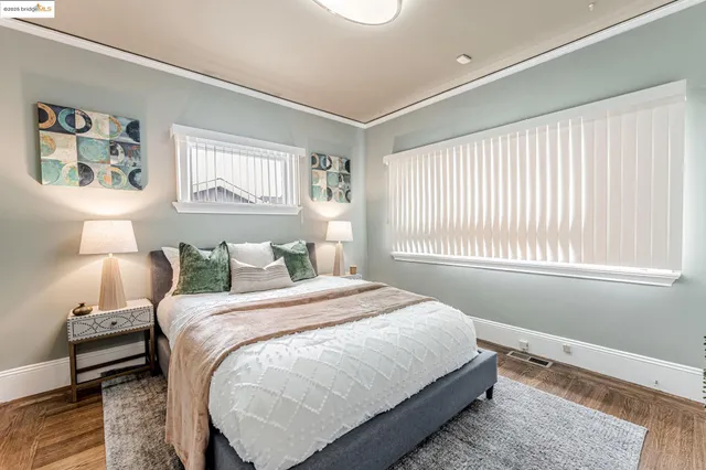 a bedroom with a bed and a night stand