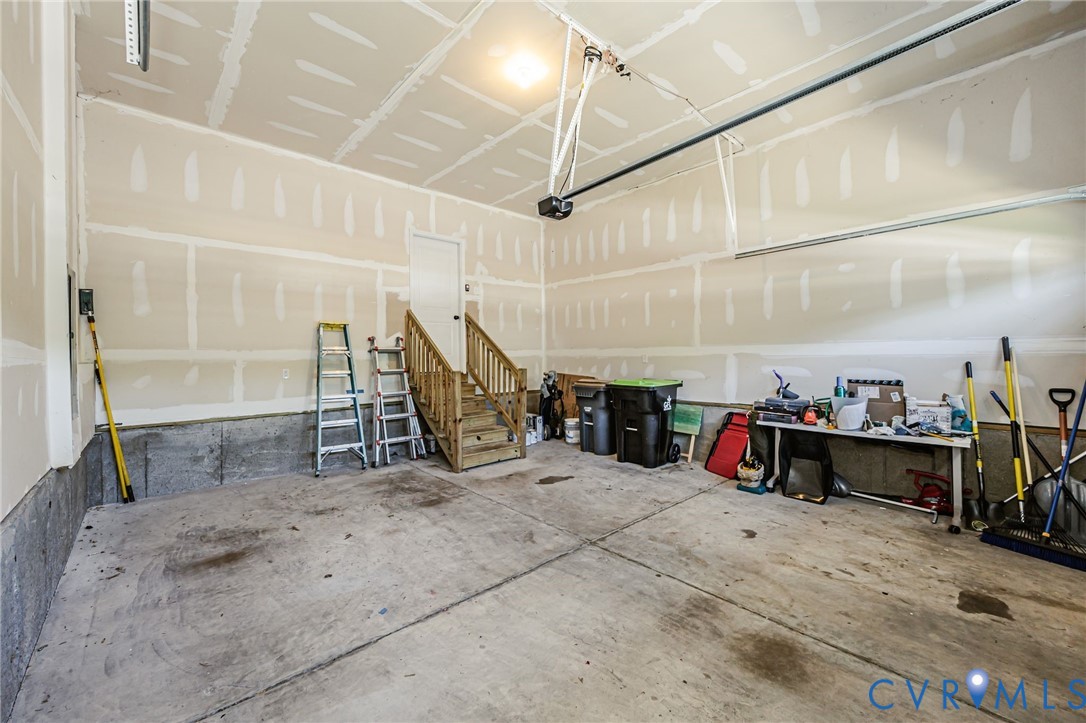 7435 Wicks Road Williamsburg, VA 23188 - Photo 82 of 82 Spacious garage featuring a concrete floor, unfini
