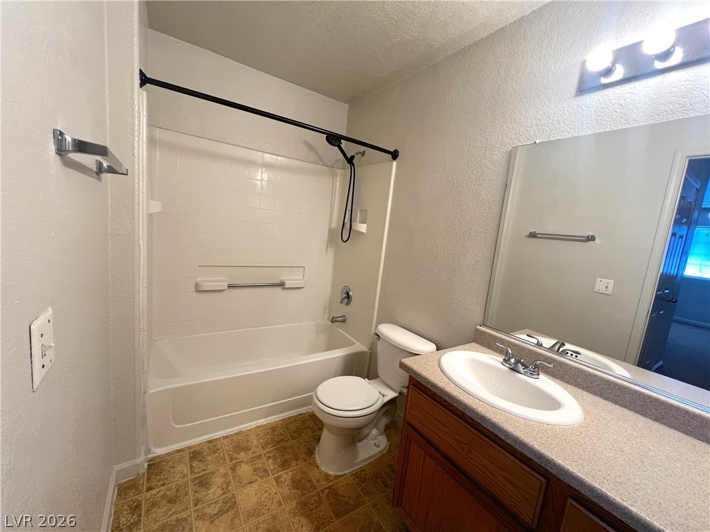 4730 East Craig Road, Unit 2104 Las Vegas, NV 89115 - Photo 12 of 20 A well-maintained full bathroom offers essential amenities for daily routines.