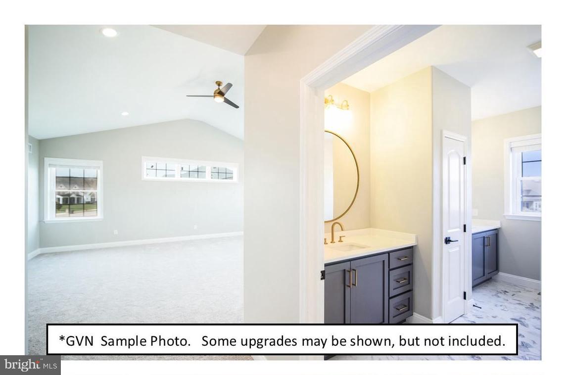 29 Fiorino Way Sinking Spring, PA 19608 - Photo 8 of 12 a bathroom with a sink a mirror and a shower