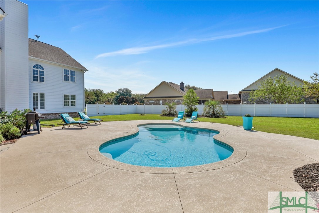 803 Honey Ridge Road Guyton, GA 31312 - Photo 43 of 50 Pool is surrounded by huge cool-decking and all th