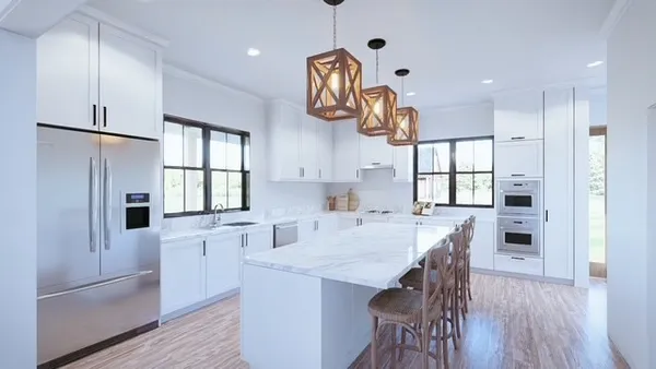 a kitchen with granite countertop a table chairs refrigerator a sink and dishwasher