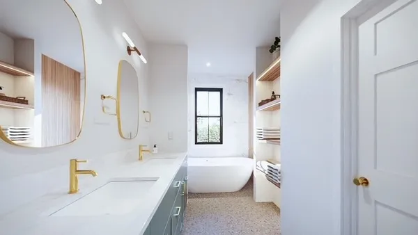 a spacious bathroom with a granite countertop sink a toilet and a bathtub