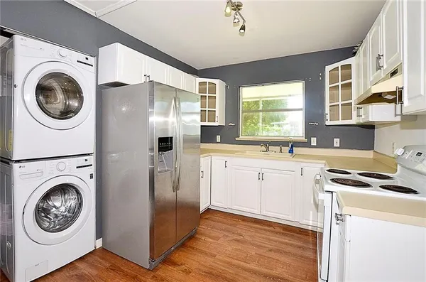 a view of a kitchen with washer and dryer
