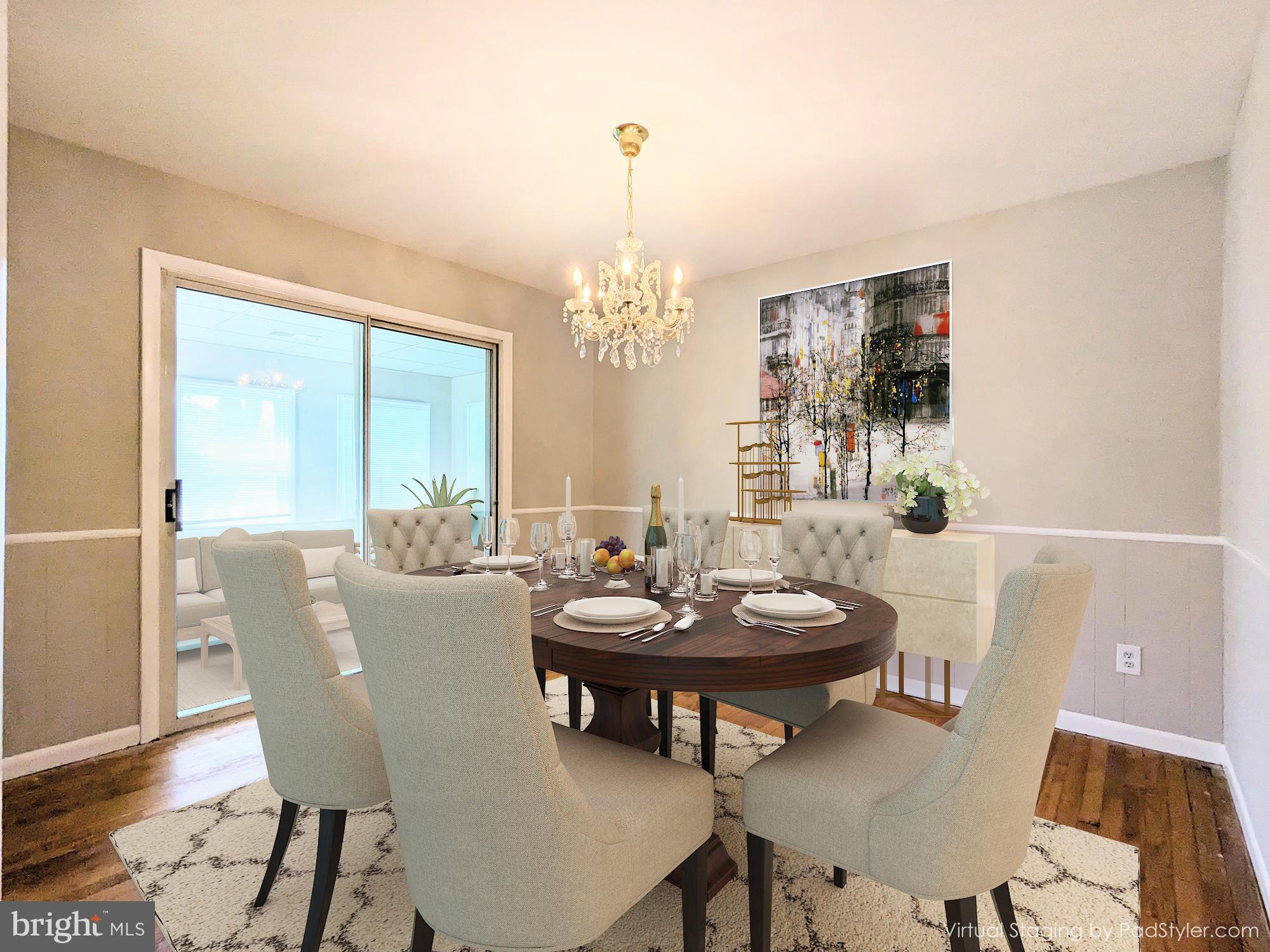 24675 Blackistone Road Hollywood, MD 20636 - Photo 11 of 27 a living room with furniture and a chandelier