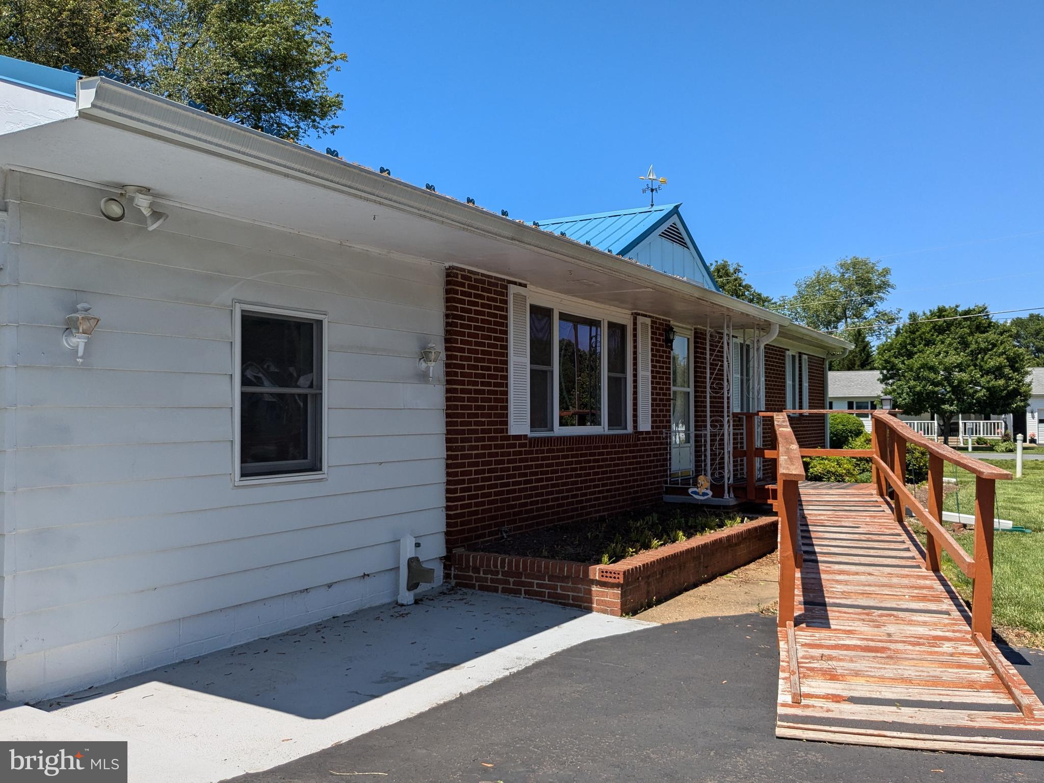 24675 Blackistone Road Hollywood, MD 20636 - Photo 14 of 27 a view of a house with wooden deck