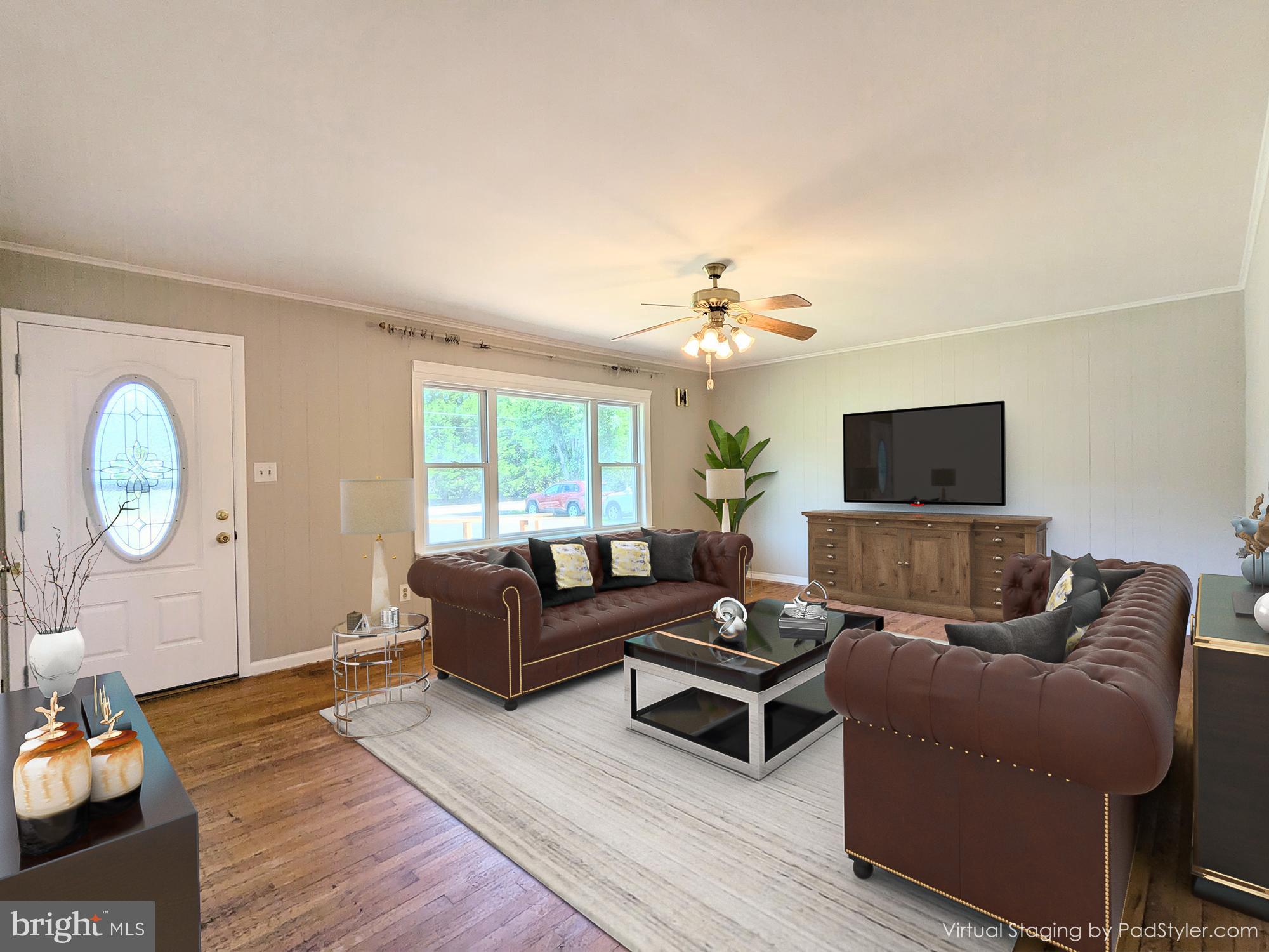 24675 Blackistone Road Hollywood, MD 20636 - Photo 21 of 27 a living room with furniture a rug and a window