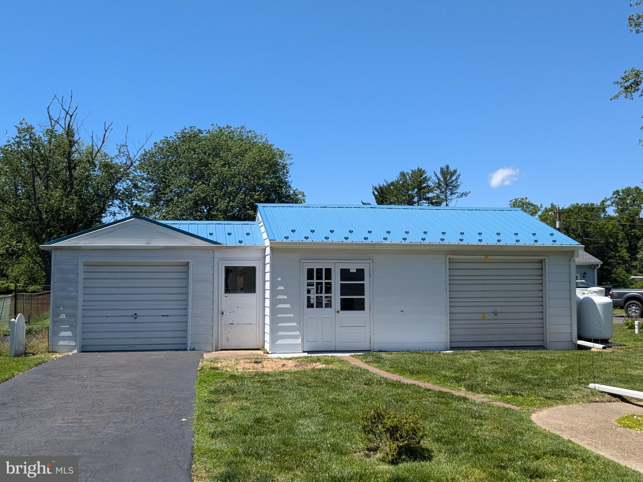 24675 Blackistone Road Hollywood, MD 20636 - Photo 6 of 27 front view of a house with a yard