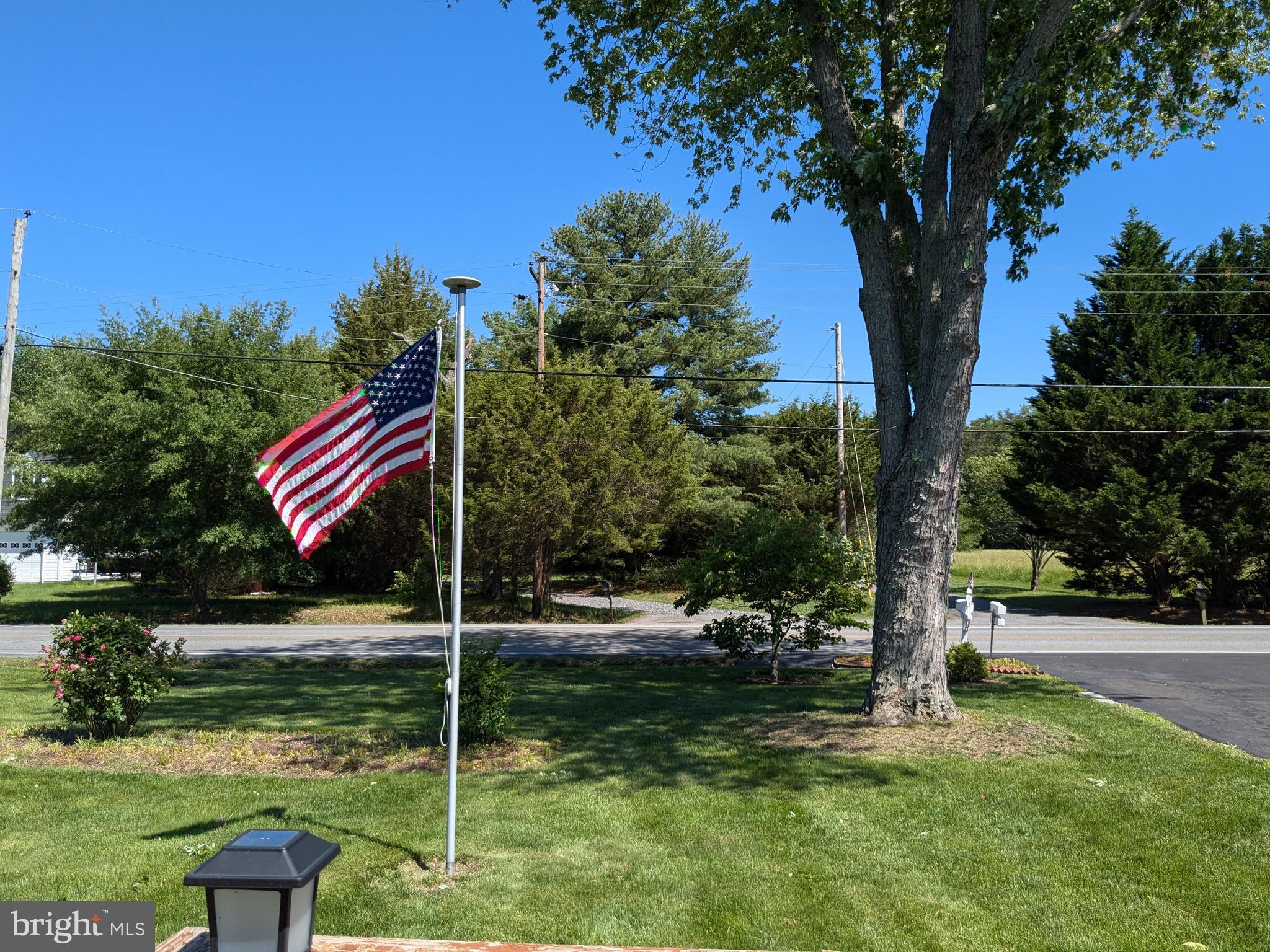 24675 Blackistone Road Hollywood, MD 20636 - Photo 7 of 27 a front view of a house with a yard