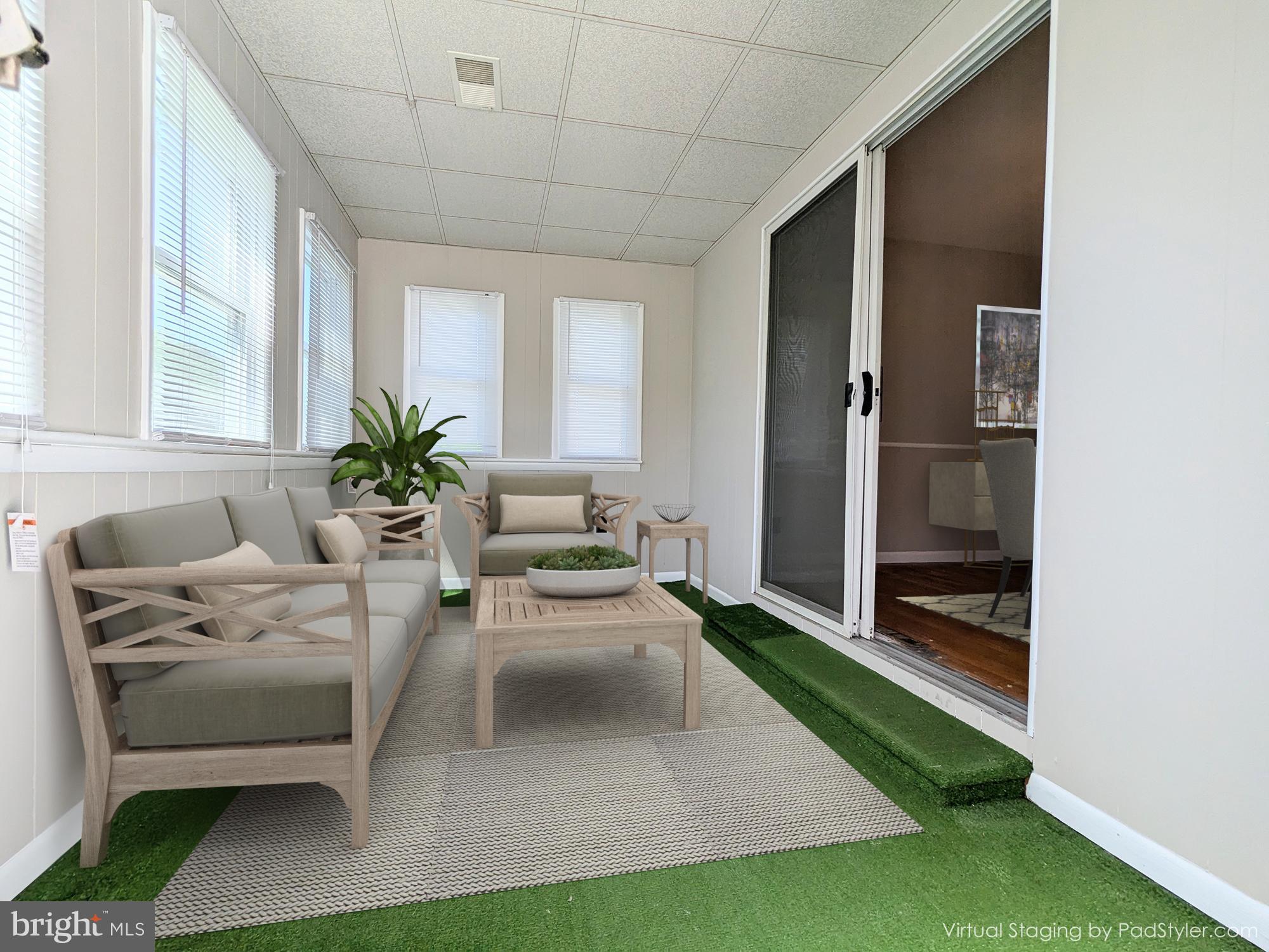 24675 Blackistone Road Hollywood, MD 20636 - Photo 10 of 27 a living room with furniture and a potted plant