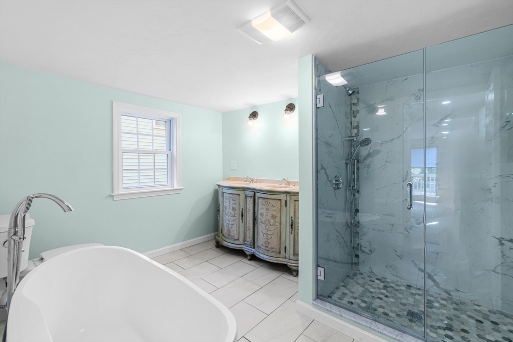 12 Sylvan Road Norton, MA 02766 - Photo 13 of 39 a bathroom with a bathtub sink mirror and shower