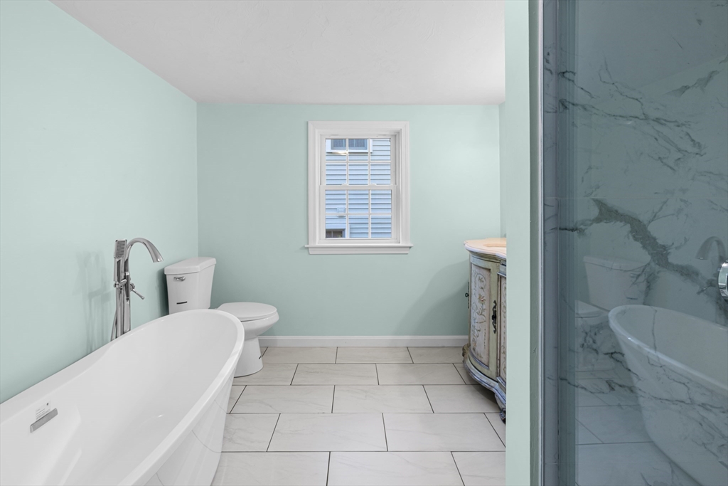 12 Sylvan Road Norton, MA 02766 - Photo 14 of 39 a bathroom with a toilet and a bath tub