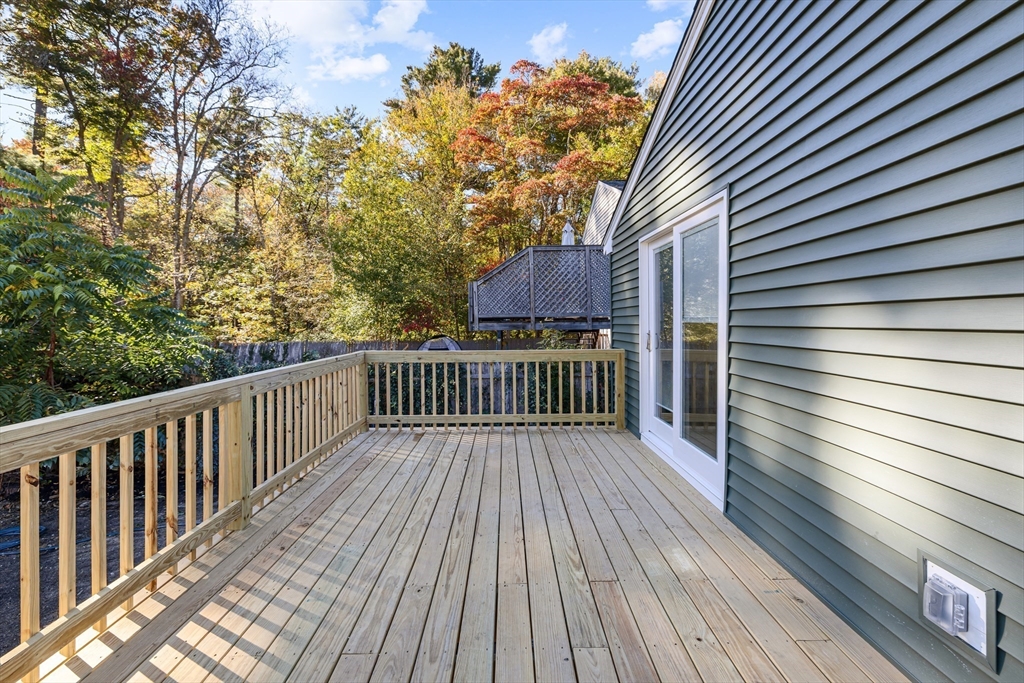 12 Sylvan Road Norton, MA 02766 - Photo 29 of 39 a view of deck with a table and chairs