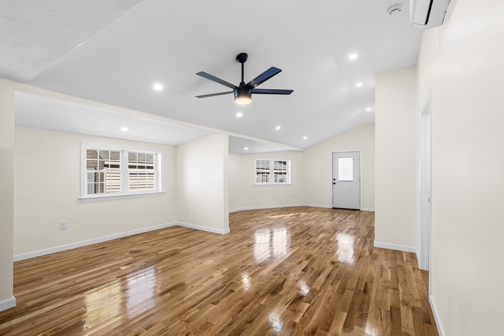 12 Sylvan Road Norton, MA 02766 - Photo 9 of 39 a view of a big room with wooden floor and a ceiling fan
