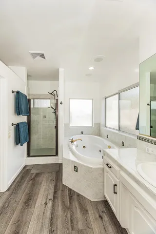 a bedroom with bed and a window