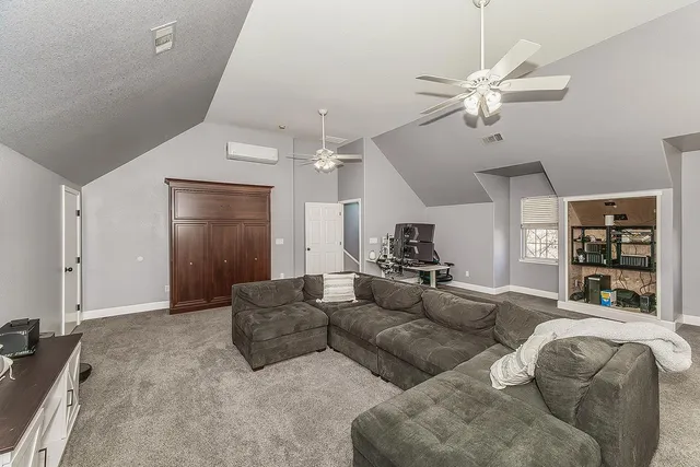 a front view of a house with swimming pool having outdoor seating