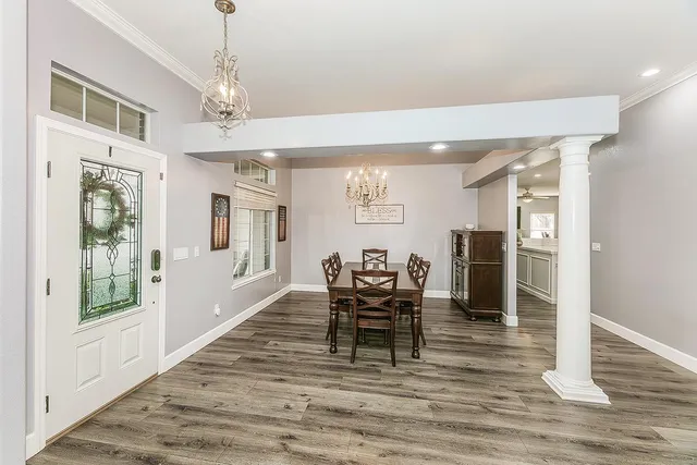 a view of a dining room with furniture window and wooden floor