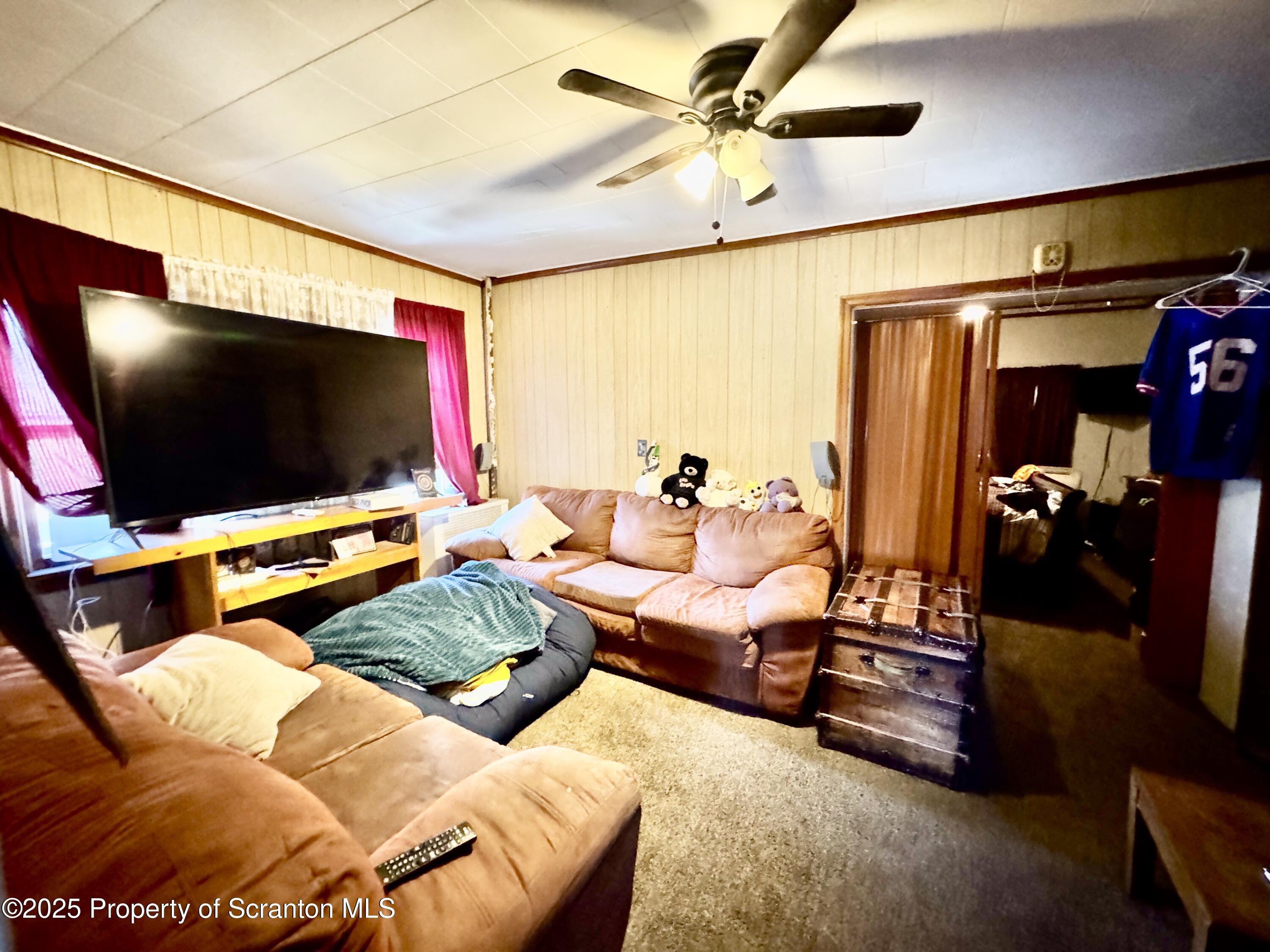 1430 North Main Avenue Scranton, PA 18508 - Photo 20 of 31 a living room with furniture and a flat screen tv