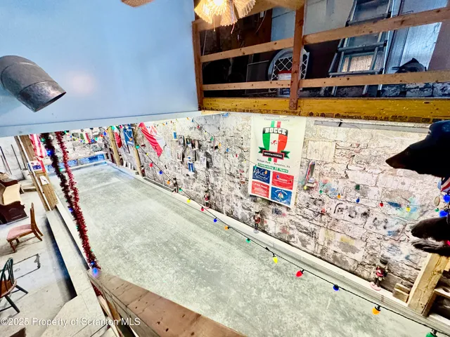 a kitchen with stainless steel appliances kitchen island granite countertop a refrigerator and stove